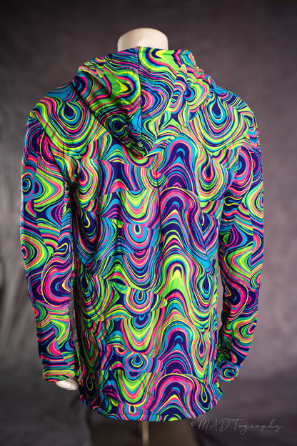 Colorful psychedelic patterned jacket on a mannequin against a dark background