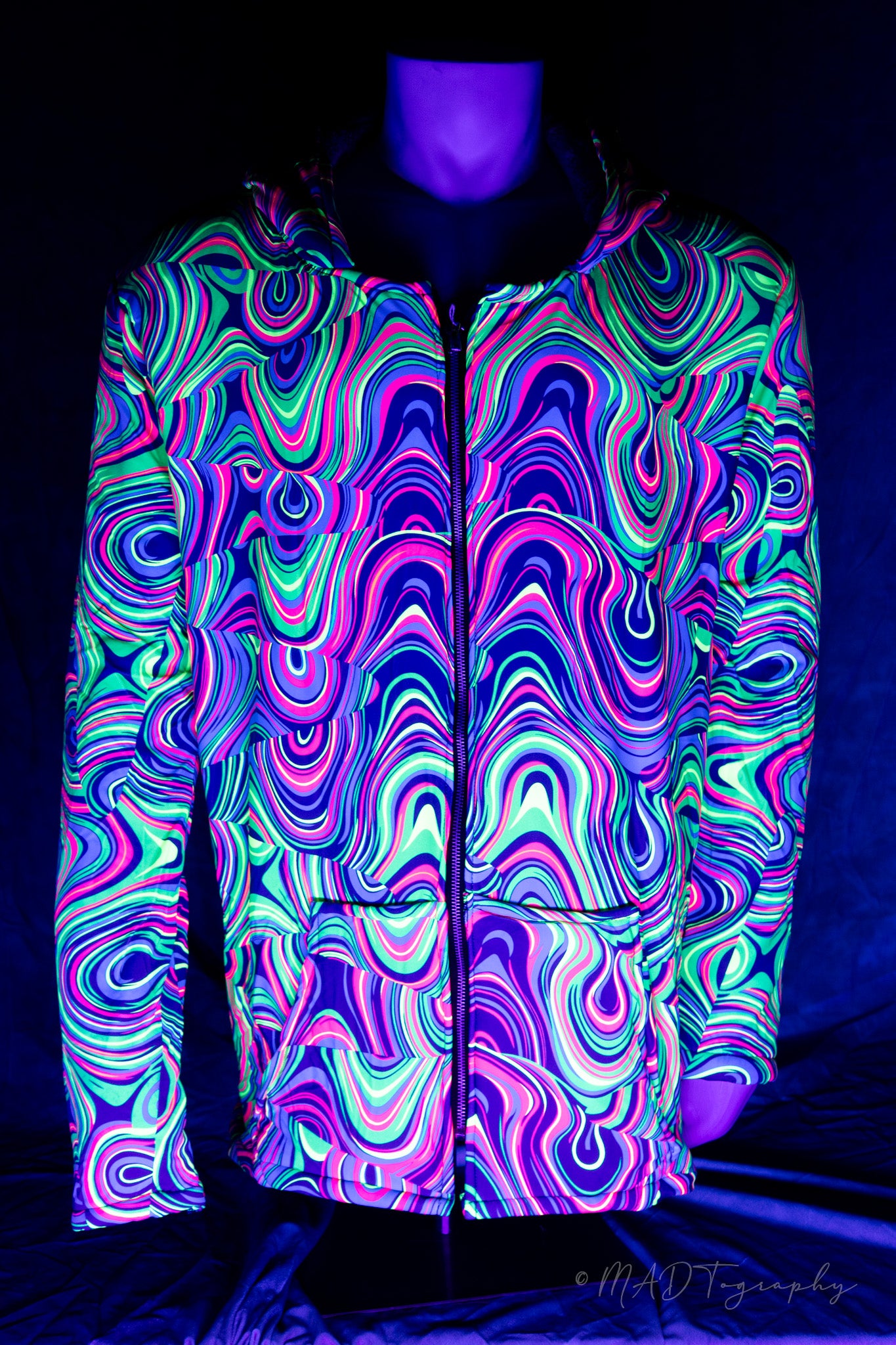 Neon patterned jacket on a mannequin against a black background